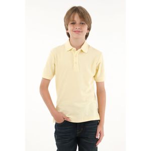 Polo amarilla con mini raqueta bordada para niño
