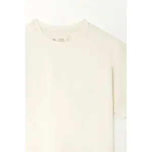 Camiseta boxy de largo pretinero crudo para niña