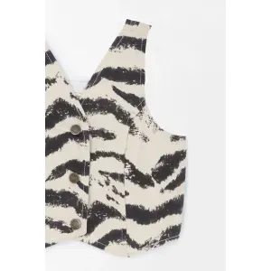 Chaleco con estampado animal print para niña