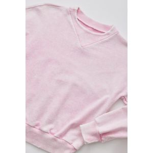 Buzo rosado con efecto desgaste para niña